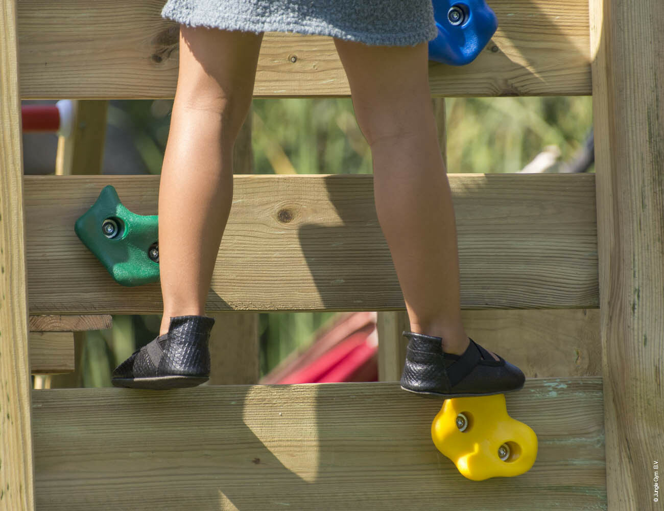 Child playing on Jungle Gym Climbing Frame